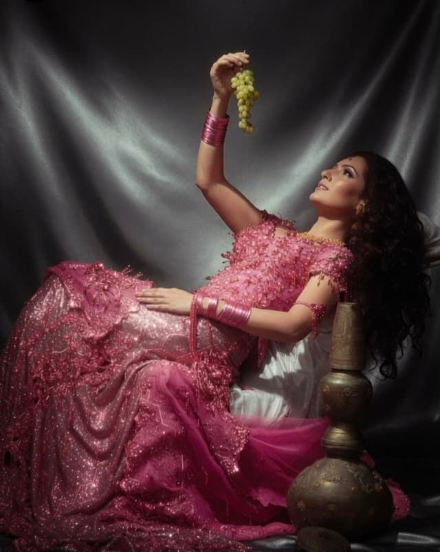 Grok Imagine Prompt - A dramatic and painterly portrait of a woman reclining elega