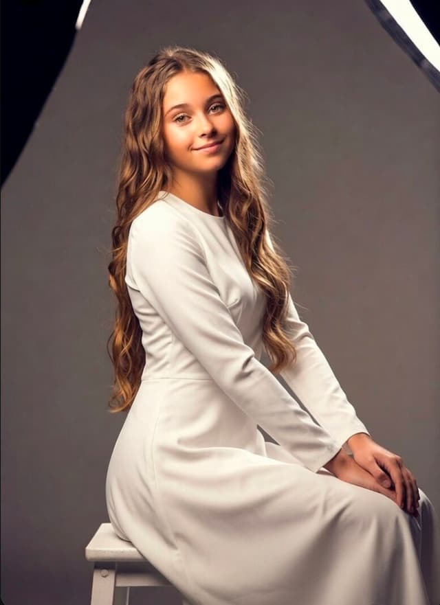 Grok Imagine Prompt - Create a high-quality studio portrait that captures the esse