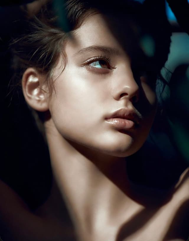 Grok Imagine Prompt - A hyper-realistic, high-detail portrait of a young woman's f