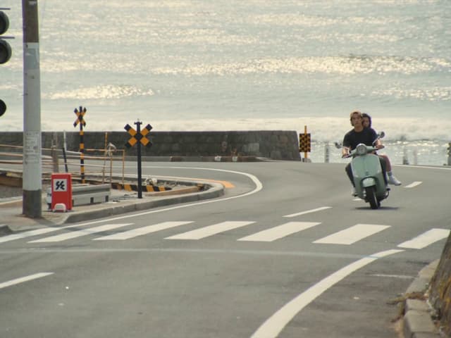 Seedance Prompt - scene context
A bright summer afternoon on the coastal road: